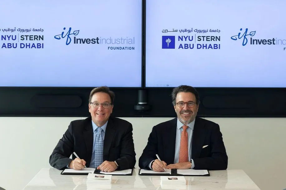 Robert Salomon, Dean of Stern at NYUAD, shown signing the Investindustrial Scholarship agreement