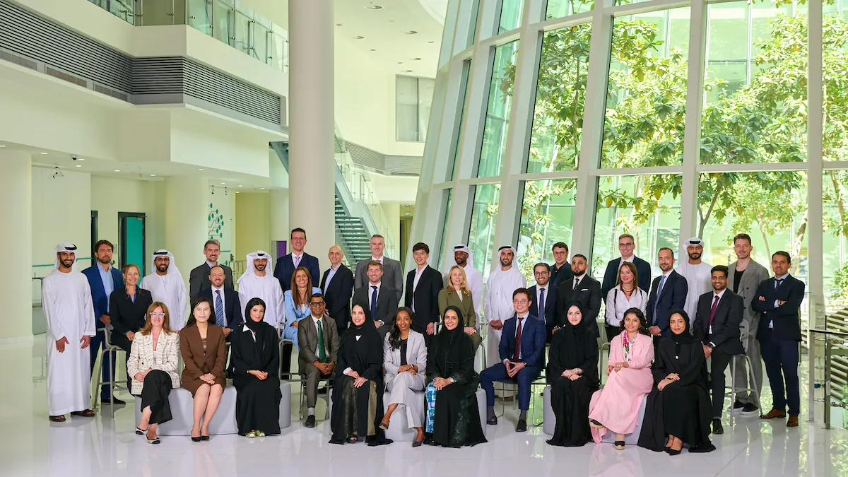 A photo of students of the inaugural Executive MBA program posing for a group photo in the A6 Stern at NYUAD building. 